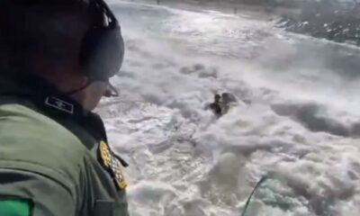 Imagens impressionantes do resgate de uma crianca puxada pela correnteza