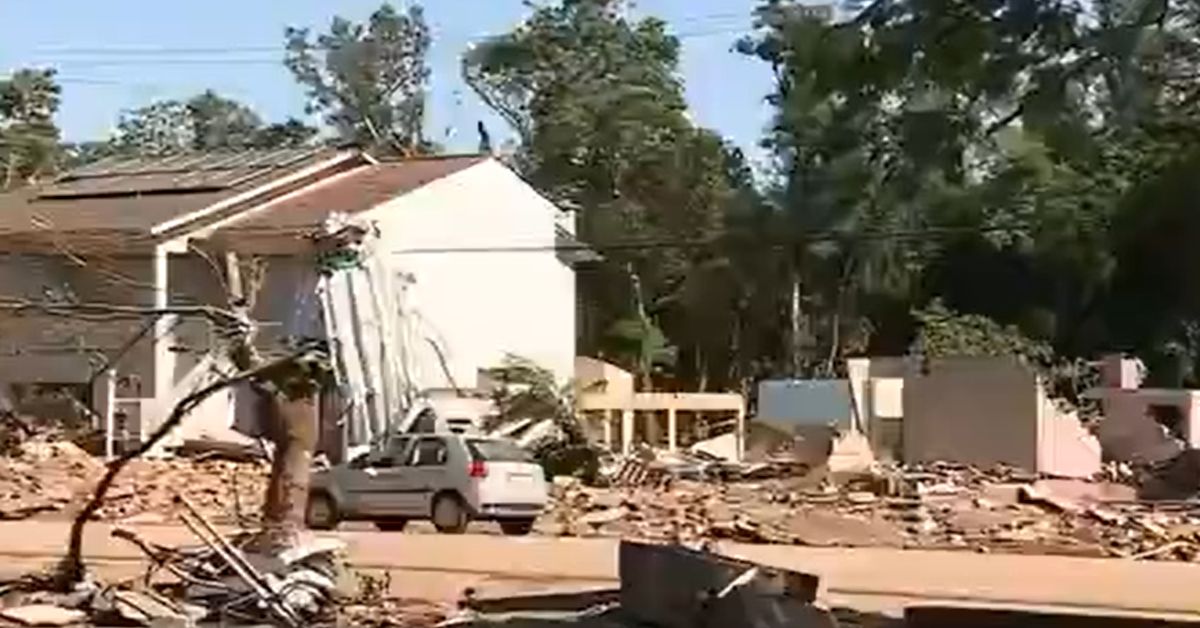 Aguas comecam a baixar e descortinam cenario de guerra no