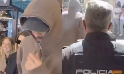 Pique e Clara Chia sao escoltados pela policia apos tumulto