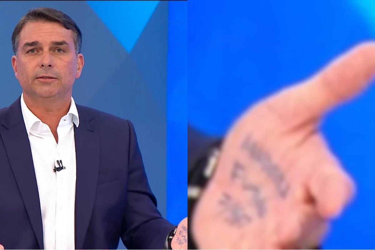 E isso que estava escrito na mao de Flavio Bolsonaro